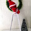 Wspinający się Mikołaj Pan Kringle